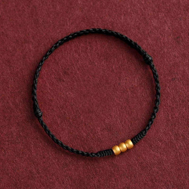 Handgemachtes Buddha - Armband mit Goldlegierung und geflochtenem Seil - Reminora